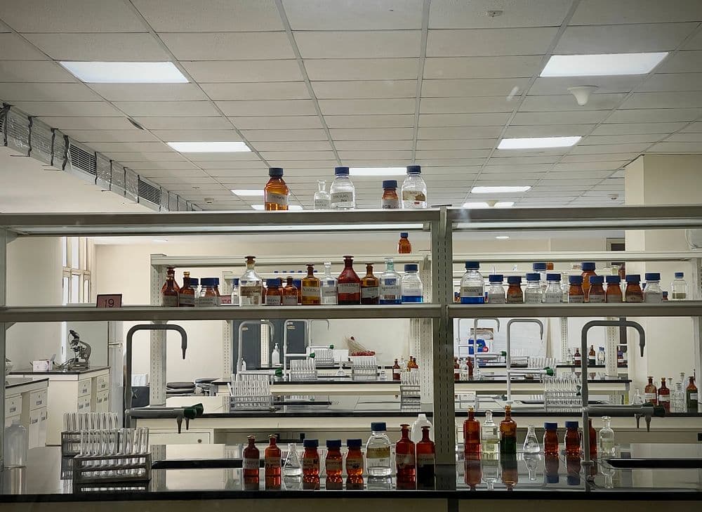 Shelves of reagent bottles in a laboratory