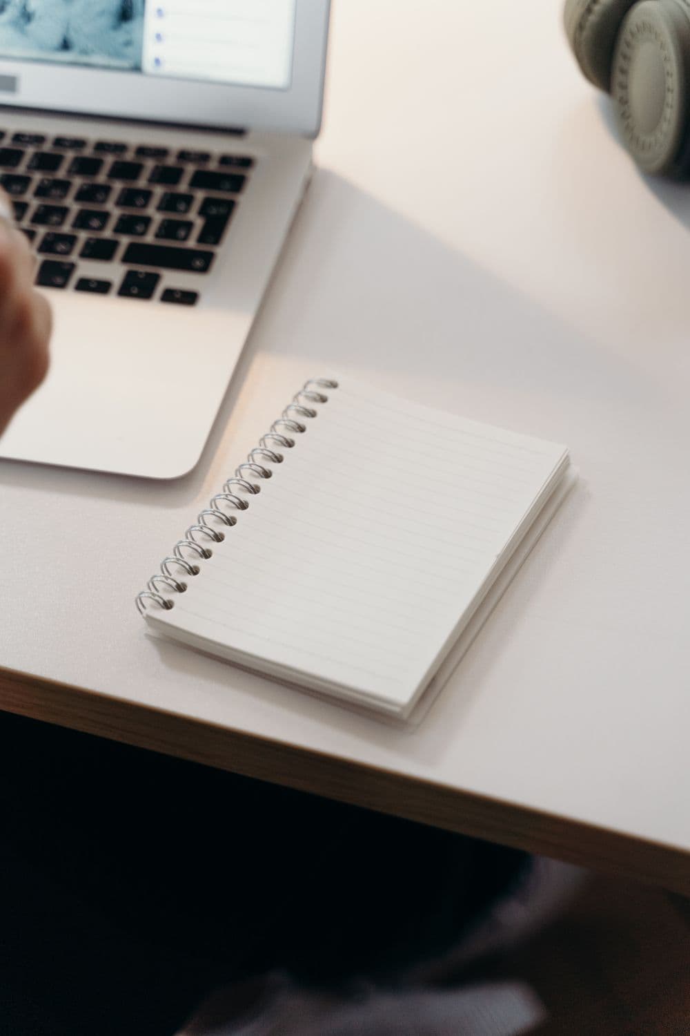 Laptop and notebook on a clean desk